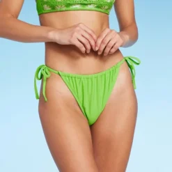 Women's Low-Rise Side-Tie Cheeky Bikini Bottom - Wild Fable™ 15 Women's Low-Rise Side-Tie Cheeky Bikini Bottom - Wild Fable™ -Wild Fable GUEST fb45f3d8 0545 4021 95ce 6cc80b70ceec